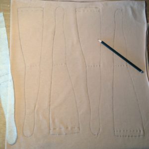 tracing the pattern on the fabric, legs in this case