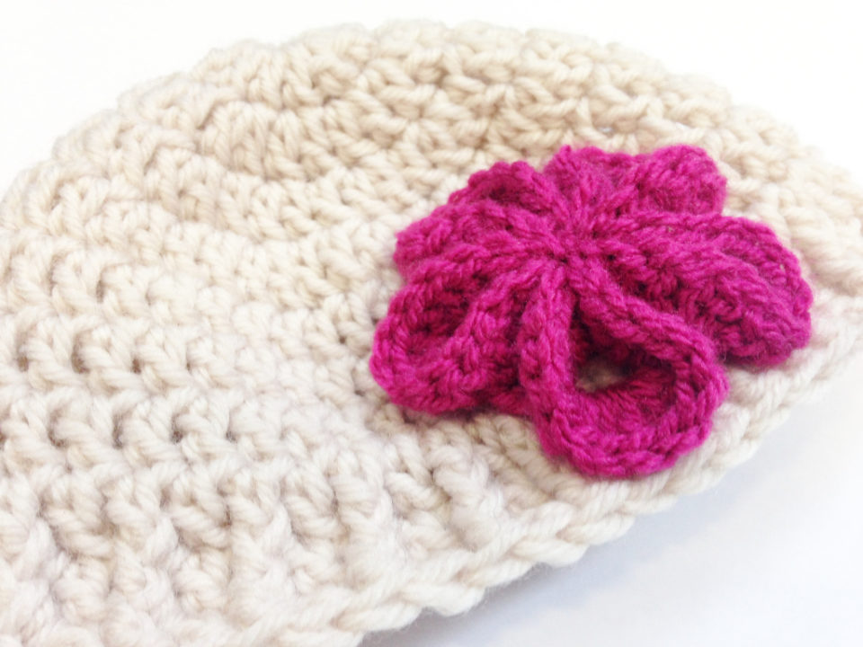 Free Pattern For A Crocheted Newborn Hat With Pink Flower made by Habiba from CraftifyMyLove.com