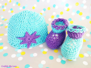 Image shows crocheted newborn booties and hat that are very cute and easy to make.