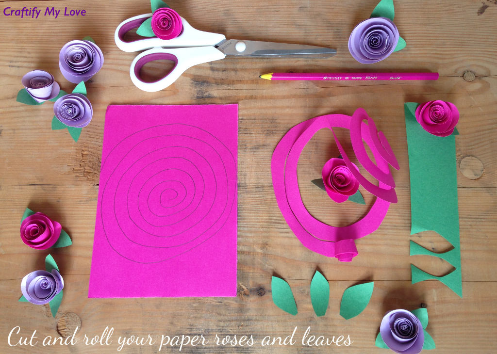 This image shows how to make paper roses - step 1: Cut our a spiral and roll it tightly. Also cut out the leaves.