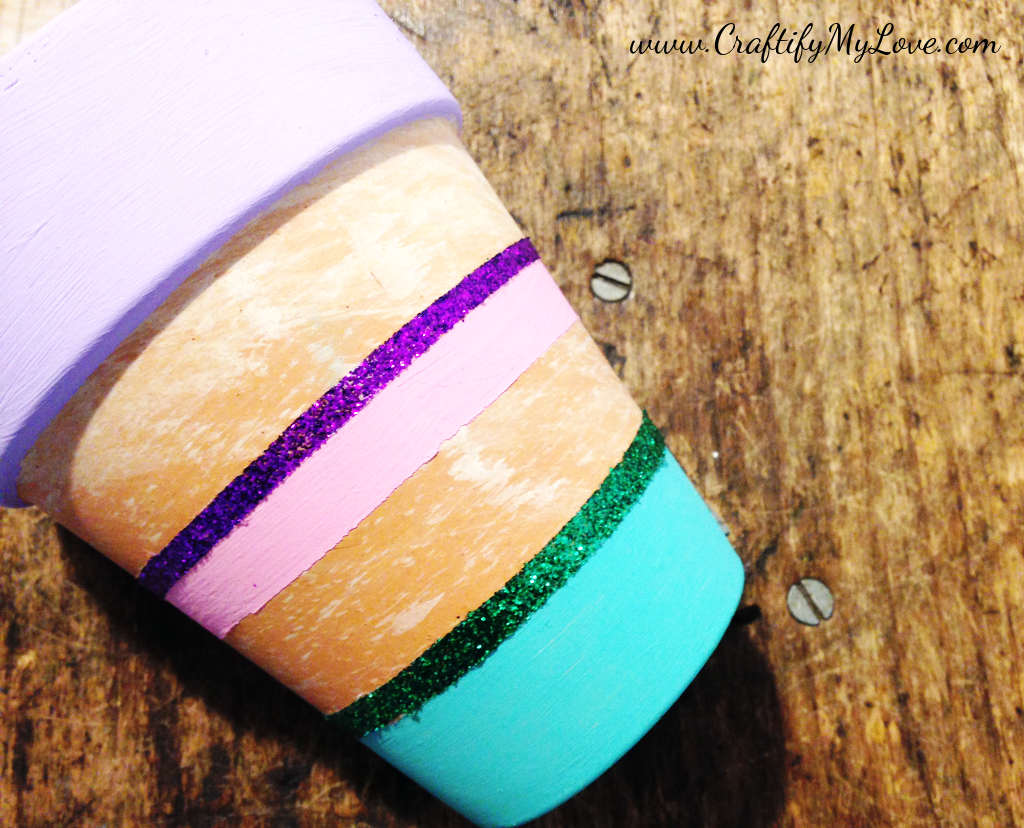 DIY spring and sparkly painted flower pot with glitter and pastel colors made by Habiba from Craftify My Love