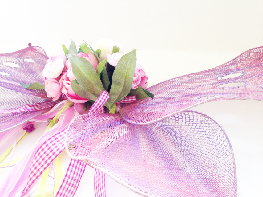 close up of handmade butterfly or fairy wings in pink, lavender and sparkle