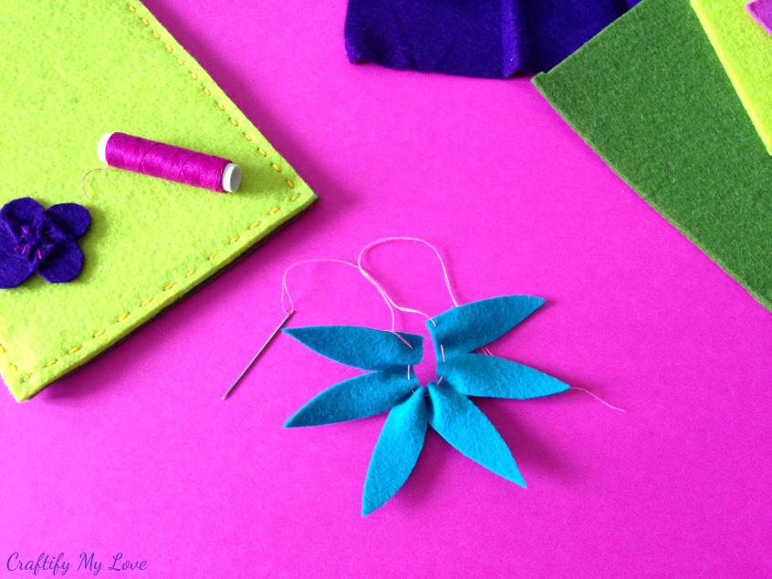 forming felt flower clematis by pulling on thread