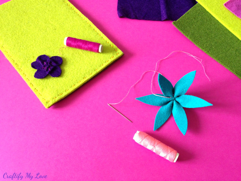 knot the thread to secure felt flower clematis and start stitching details to flower