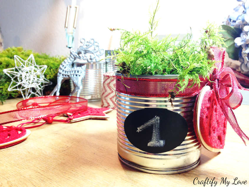 sticking chalk board sticker to recycled tin can advent decoration