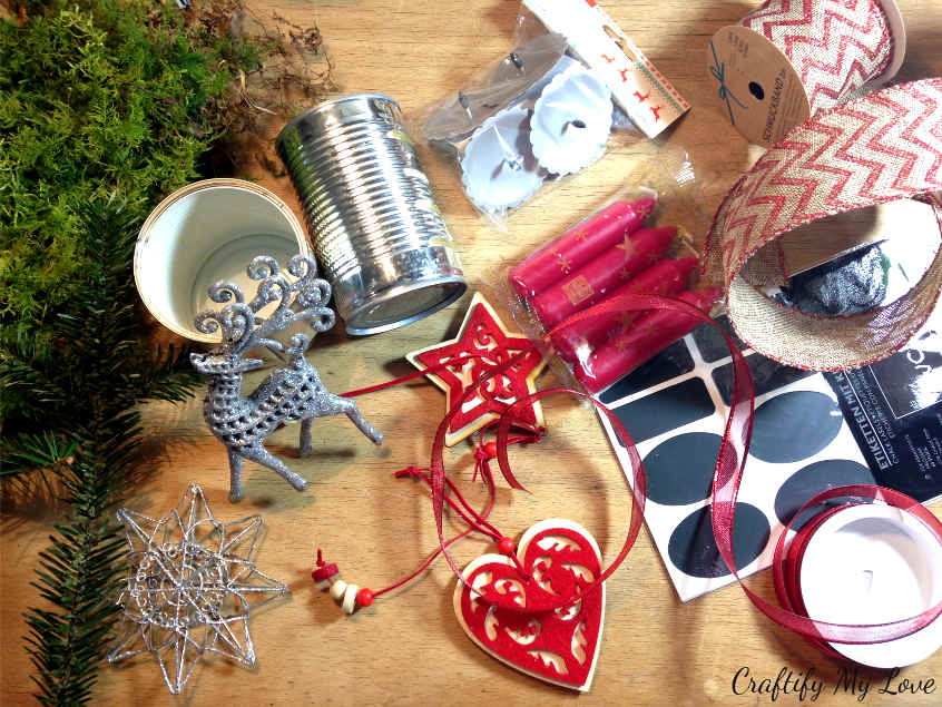 Supplies for a recycling craft project using old cans for a DIY Christmas decoration