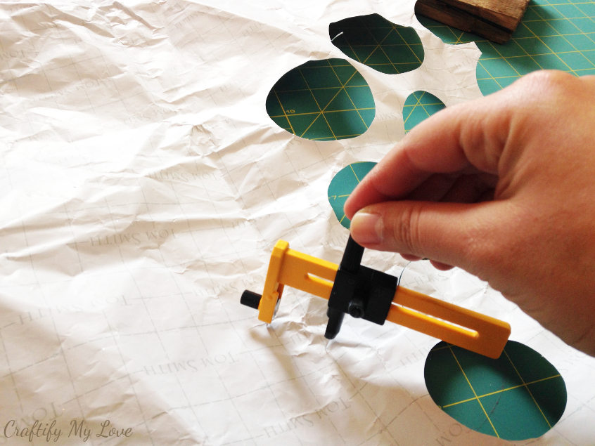 Cutting wrapping paper circles with a compass circle cutter