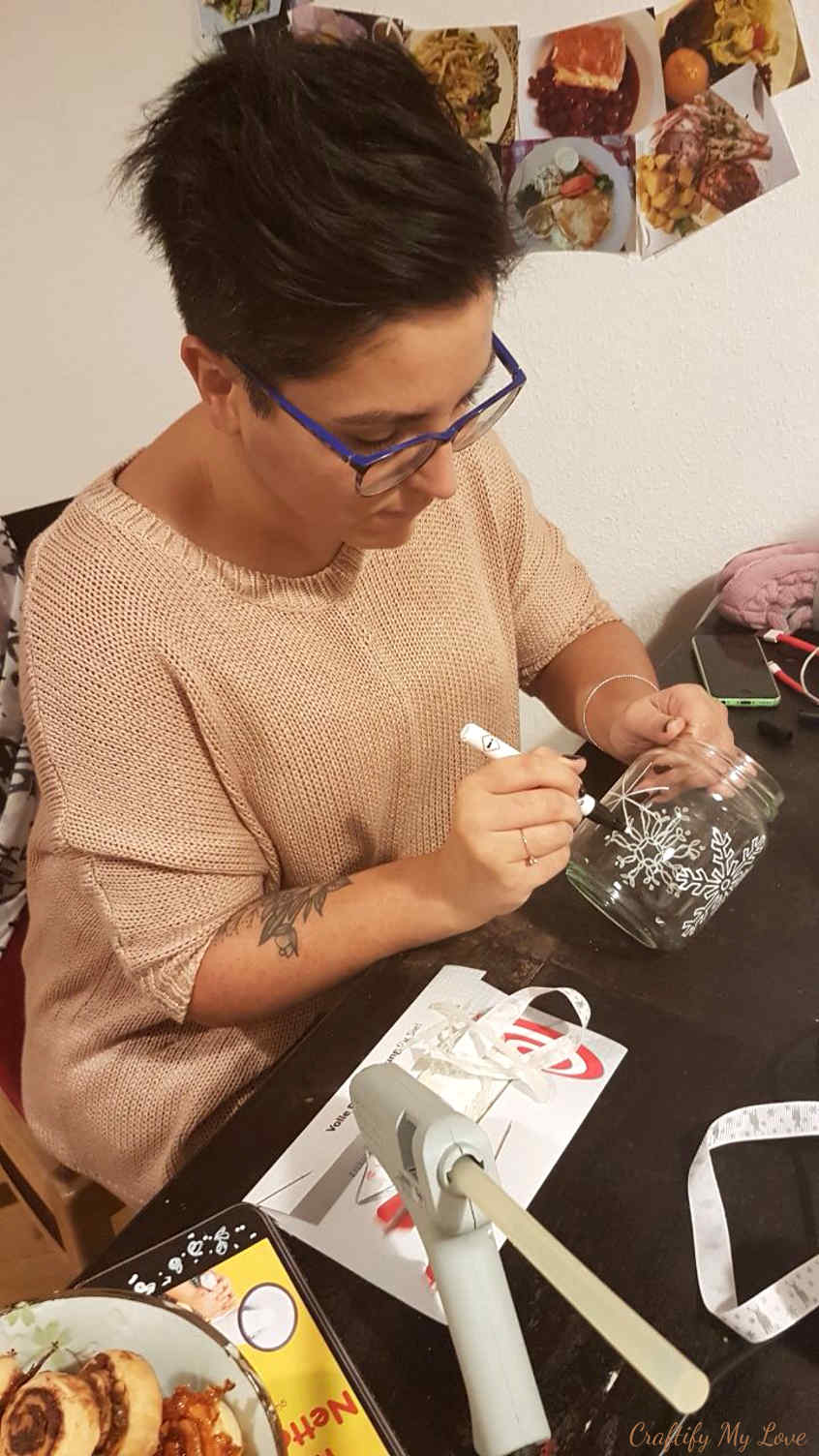 hand painting snowflakes on recycled jars candle holder