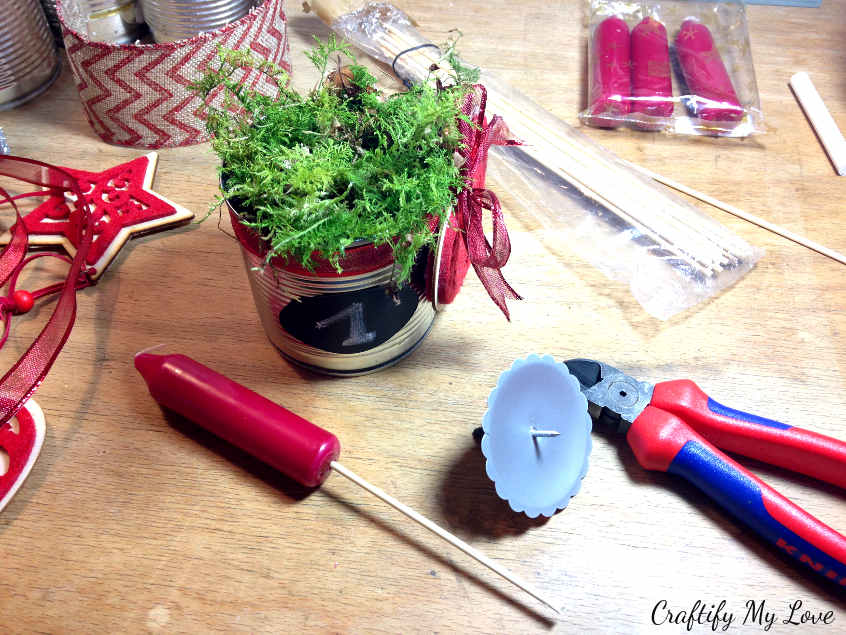 preparing the candle with a shashlik stick for a Christmas DIY project