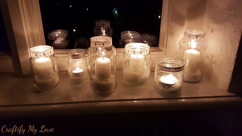 snowflake sharpie painted jars turned into candle holders