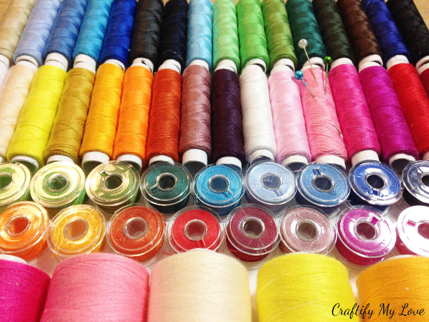 colourful DIY sewing or craft room decor recycling bobbins