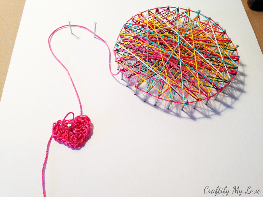 crocheted heart string art ball of yarn wall art for craft room