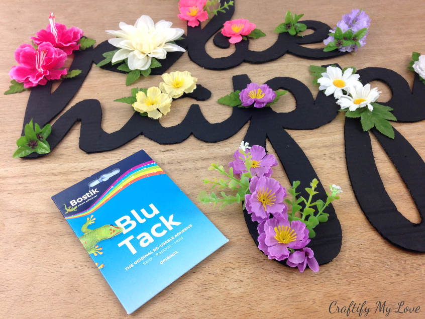 blutack is a removable adhesive that is ideal for sticking your motivational sign to the wall