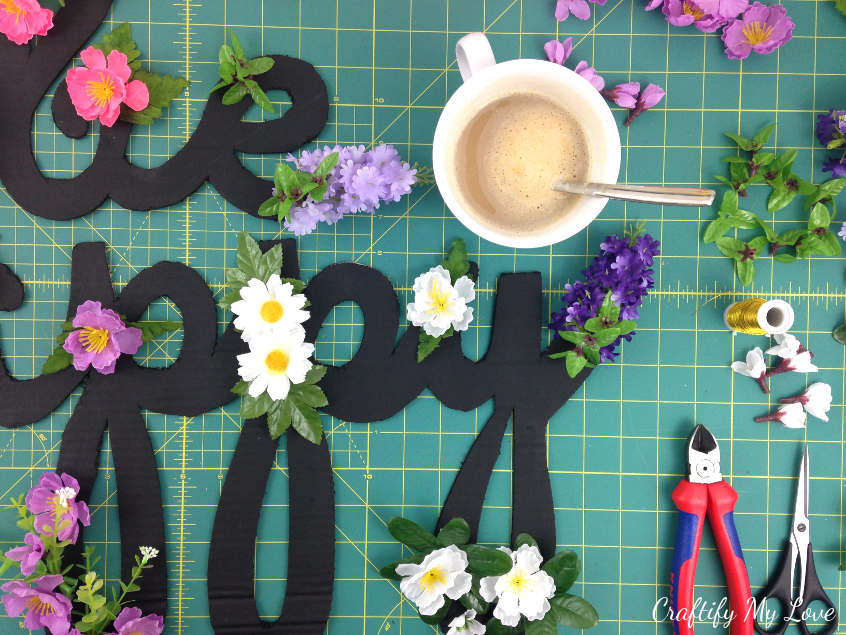 coffee break during a diy crafts project to make an upcycled motivational be happy cardboard cut-out sign