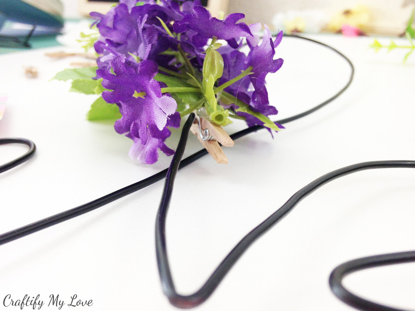 decorate your wire grid memo board with silk flower wooden pegs or clothespins