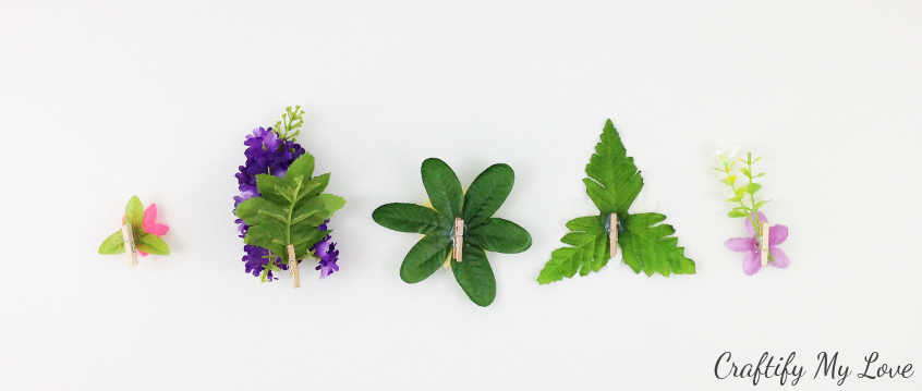 die memo pegs made from wooden clothespins and silk flowers