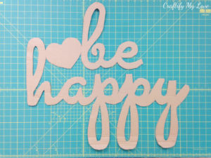 this cardboard cut-out lettering will be the base for your hand painted be happy motivational wall art