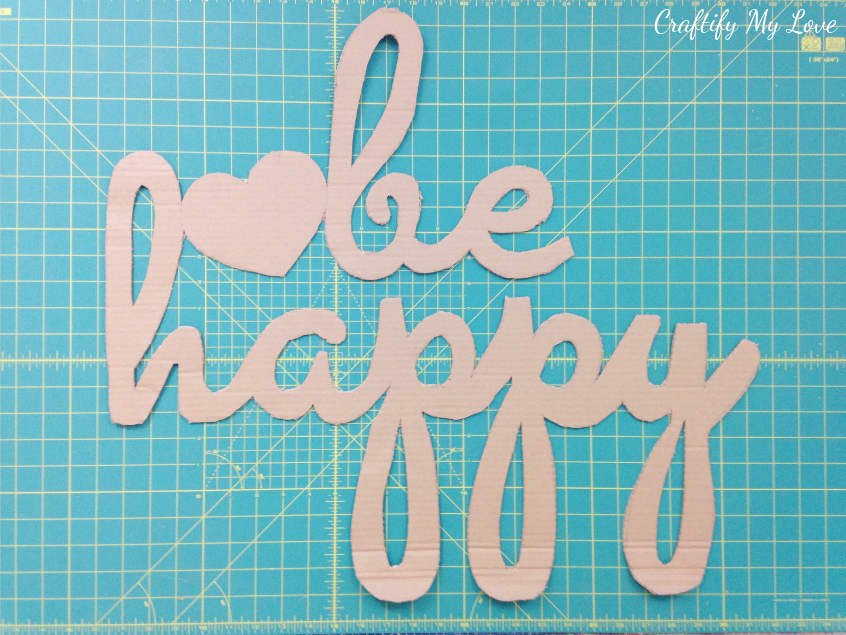 this cardboard cut-out will be the base for your hand painted be happy motivational wall art