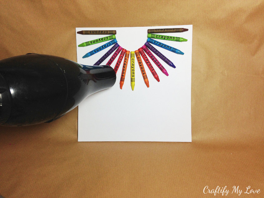 melting crayons in less than 3 minutes with a blowdryer is a simple and decorative kids craft