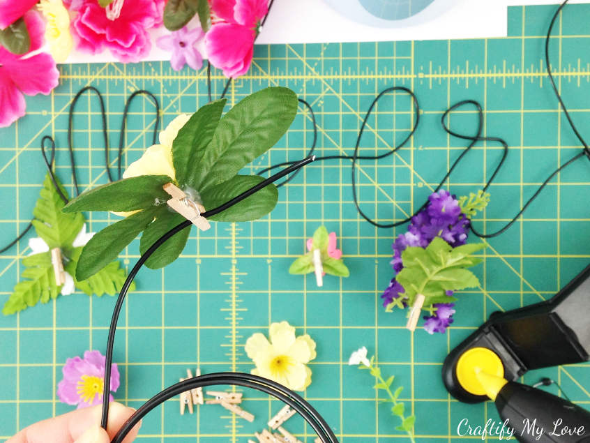 simply clip handmade floral photo pin or peg to wire grid board