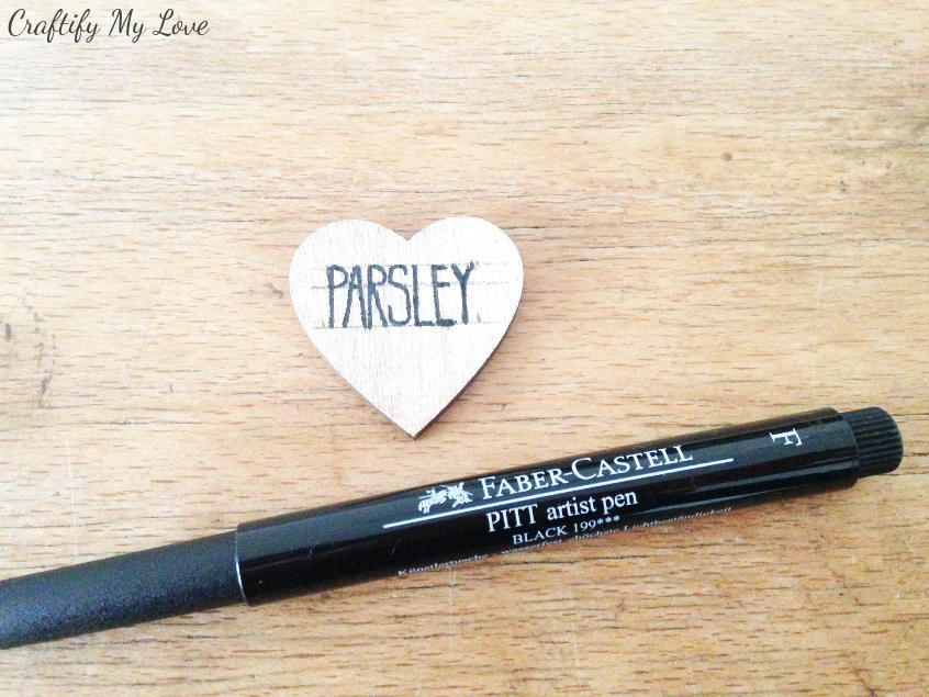 adding the herb name to your heart shaped DIY plan marker with an artist pen size F