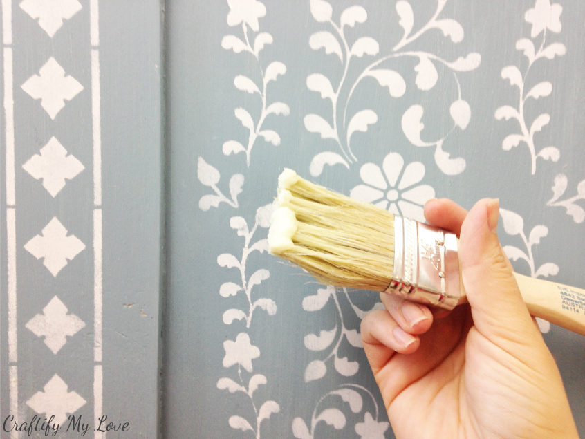 apply the wood wax with a brush to your completely stencilled and dried upscaled anthropologie look dresser