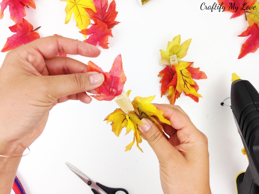 giving the clothespin autumn fairy a fall leaves hat or hairdo is pretty simple