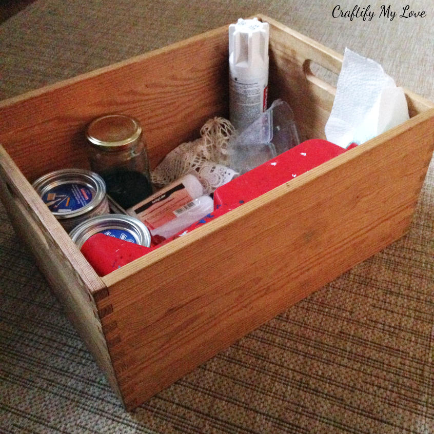 supplies for an upcycled wooden storage box using stain and a stencil