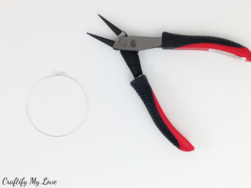 bending the ends of the wire hoop outwards for darling crocheted earrings