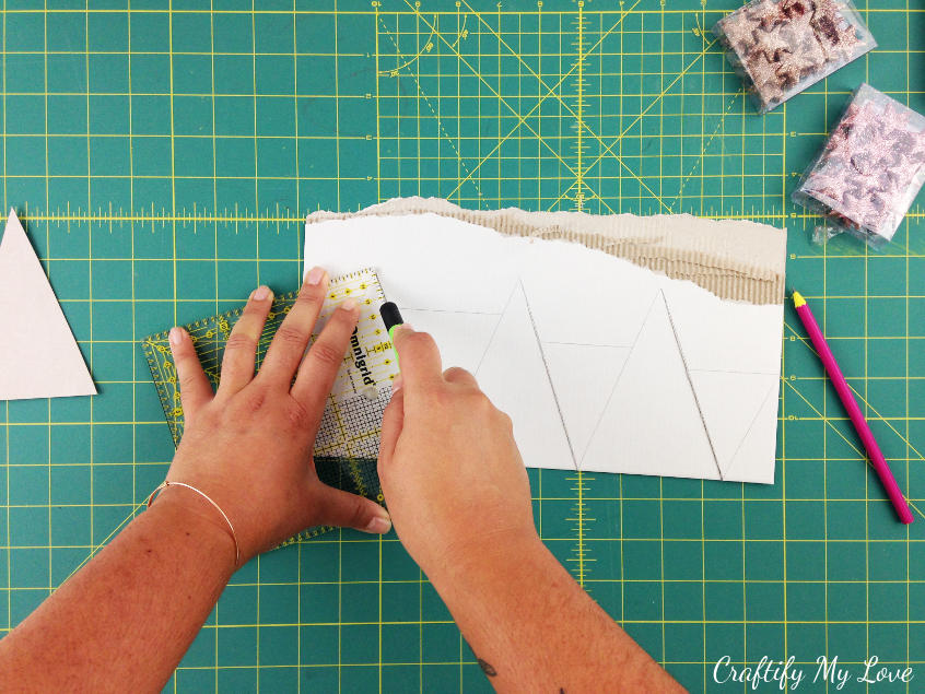 Cut out triangles of different sizes for a paper Christmas tree 10 minute craft