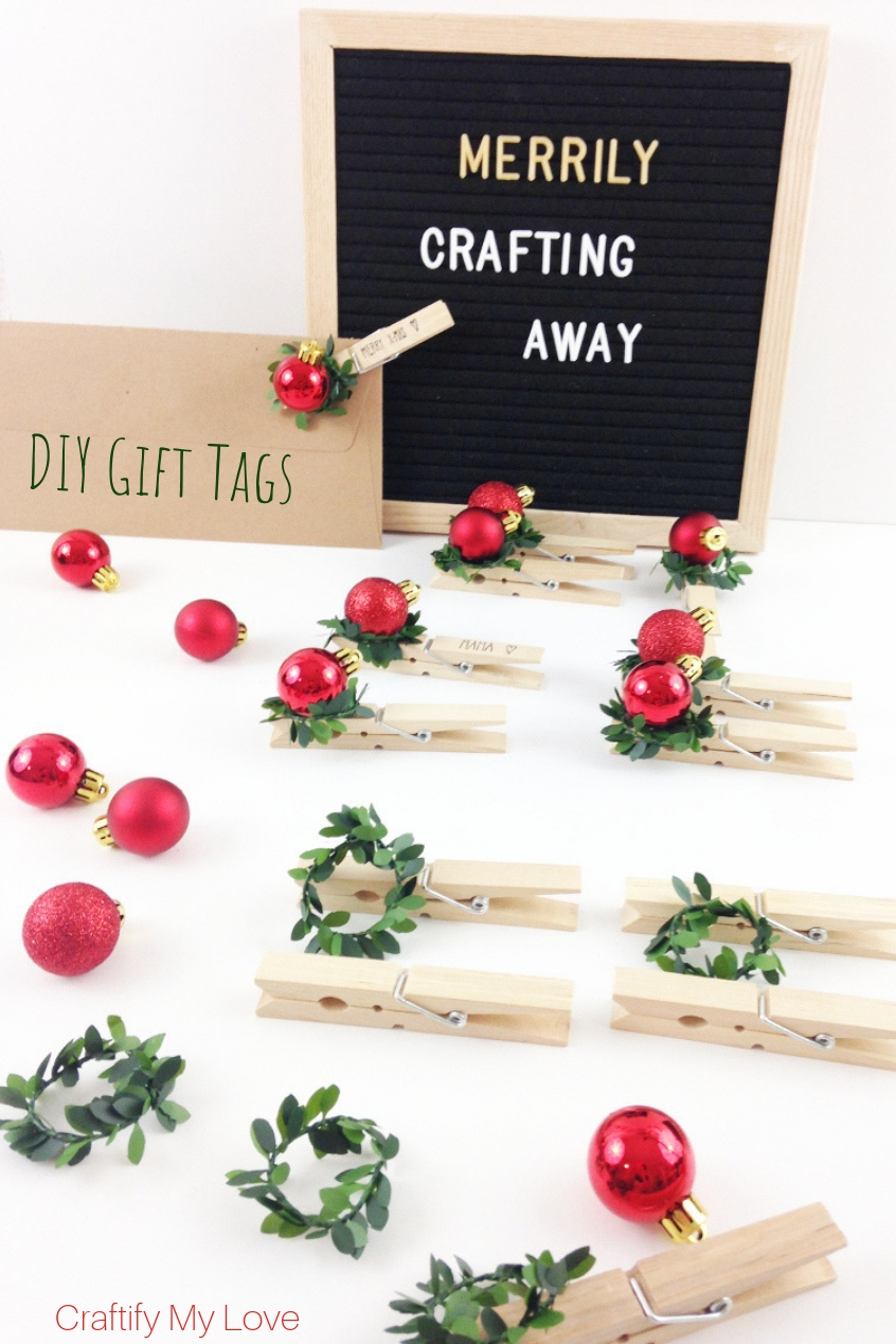 DIY Gift tags from clothespins, faux bow, and Christmas balls. Click to learn how easy they are made. #craftifymylove #DIYgifttags #greenandred #Christmas #clothespincraft