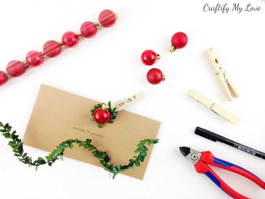 Supplies to make traditional red&green Christmas ball gift tags