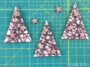 Mixed-media Christmas trees from upcycled shoe box, yarn, and glitter stars