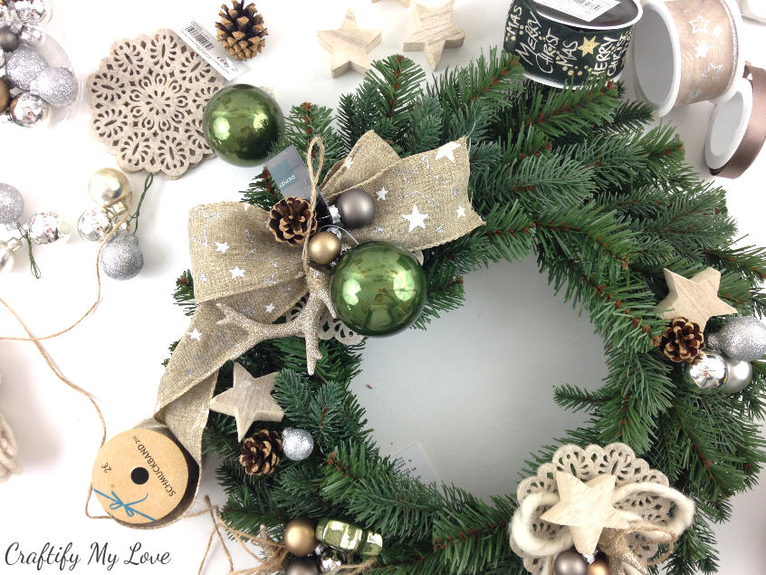 pre-arrange individual decor elements to get started on your design for a unique DIY deer winter wreath