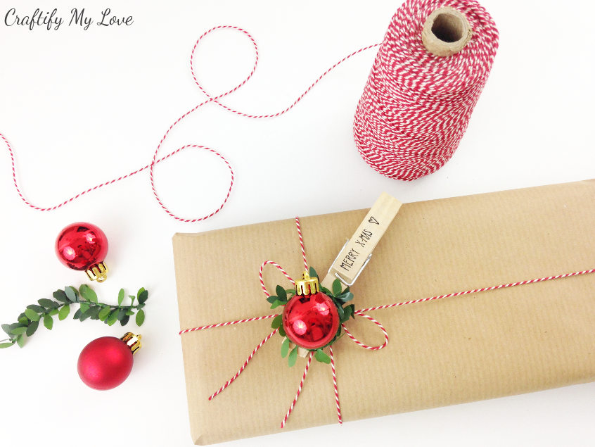 Pretty presents: Git wrapping idea for Christmas using basic brown paper and a traditional red and green color scheme in the embellishments