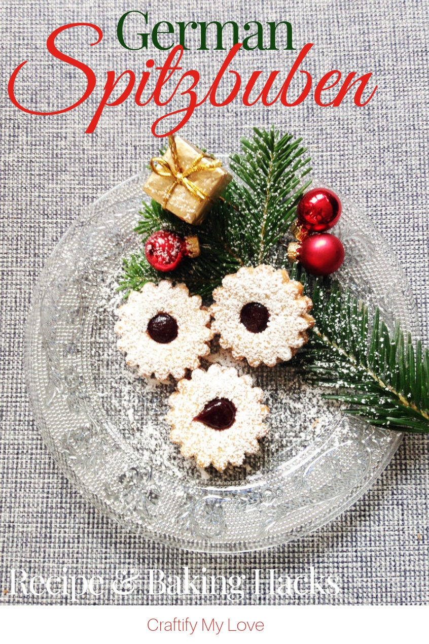 Spitzbuben, my favourite German Christmas Cookies ever! Click for the recipe and detailed step-by-step directions on how to make the dough, bake, and decorate them. BONUS: Nifty kitchen hacks for baking. #craftifymylove #Christmascookies #GermanChristmasbakery #kitchenhacks #recipe #sweettreats