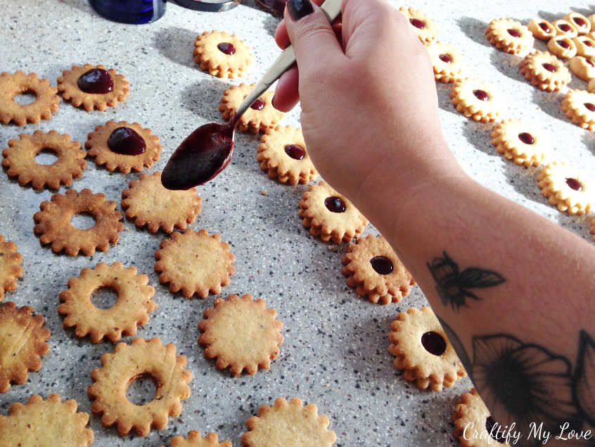 The assembly of my favourite Christmas cookies: I am using any red jam (strawberry, cherry, raspberry)