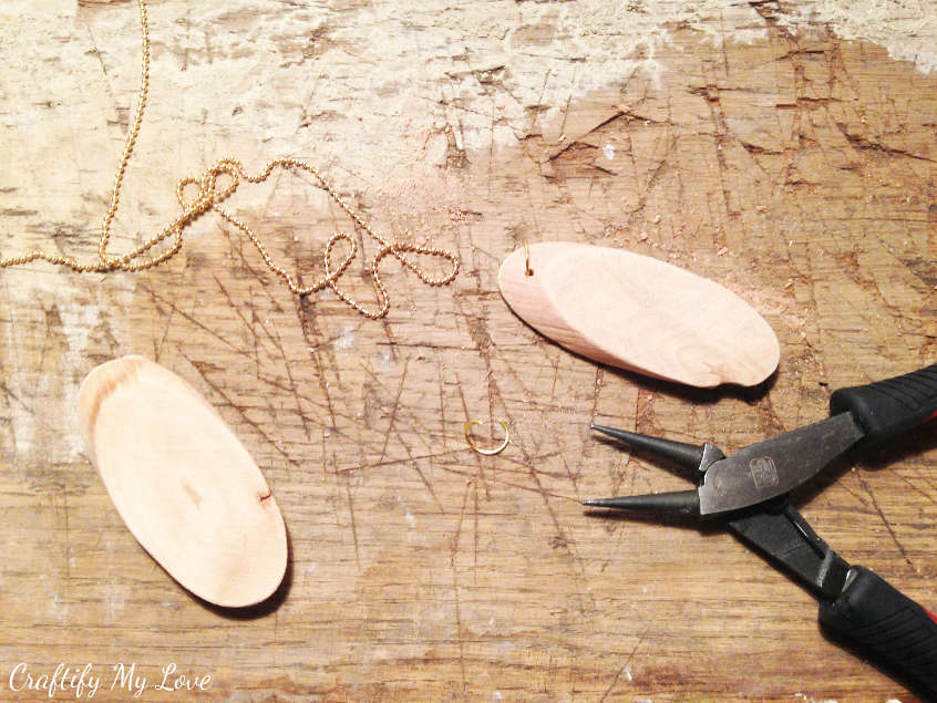 Adding the hanger to your wood slice diy jewelry pendant or key ring