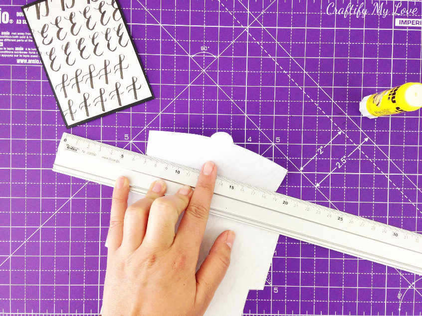 bend the edges of DIY mini envelope with a ruler