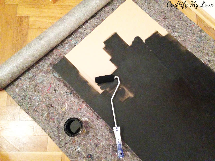 Paint the plywood board with chalk board paint. For best results use a foam roller