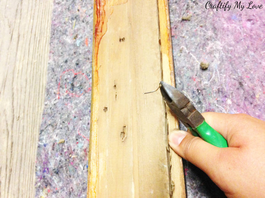 prepare the antique picture frame by cleaning it and removing old nails to DIY an upcycled chalk board