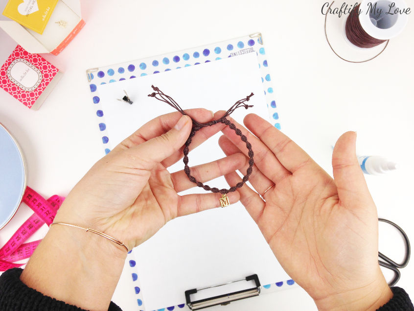 step by step video tutorial on how to make a simple macrame bracelet with a charm and an adjustable sliding knot clasp