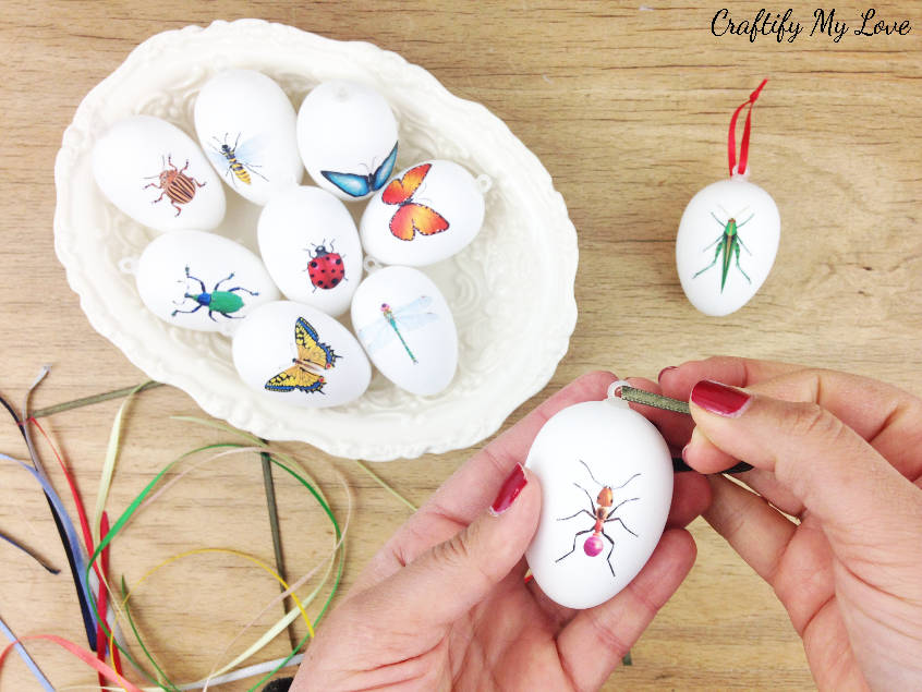 Learn how to get free craft supplies to add a beautiful satin ribbon to your decoupage Easter eggs sporting all sorts of cute little creepy crawlies