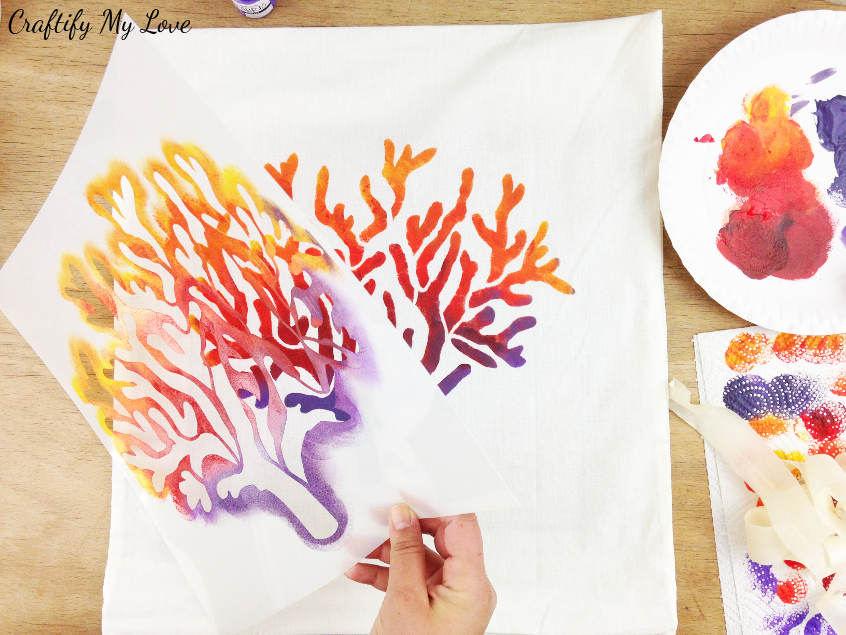 how to stencil a pillow ombre in a coral nautical design from yellow, orange, red, to purple