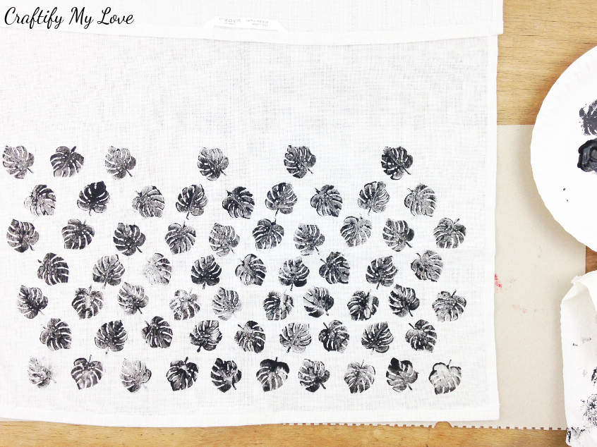 building up the pattern of monstera leaves DIY handstamped tea towel